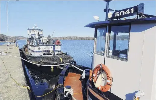  ?? Photos by Paul Buckowski / Times Union ?? The state Canal Corp. started a pilot program to use tugboats and a dredging device to help limit ice in the Erie Canal this winter.