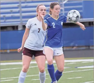  ?? Scott herpst ?? Ringgold’s Riley Poe keeps her eye on the ball, while shielding it away from a Dade County defender during a match last week. The Lady Tigers collected their first win of the season Friday night at Cass.