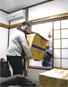  ??  ?? A Nepalese worker moves into company housing that was renovated from a vacant house in Hadano, Kanagawa Prefecture. — Photo by Japan News-Yomiuri photo