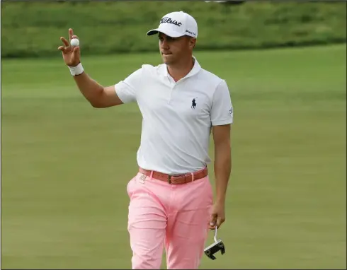  ?? Associated Press ?? Golf: Justin Thomas reacts after his birdie on the 17th hole during the third round of the U.S. Open golf tournament on Saturday.