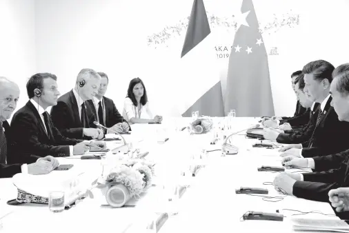  ??  ?? FRANCE’S President Emmanuel Macron (2nd L) attends a bilateral meeting with China’s President Xi Jinping (2nd R) during the G20 Summit in Osaka on June 29, 2019. Ludovic MARIN / AFP