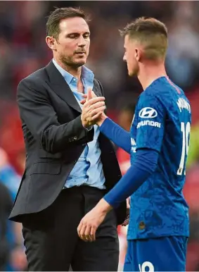  ??  ?? Make it count: Chelsea manager Frank Lampard (left) shaking hands with Mason Mount after the Premier League match against Manchester United at Old Trafford on Aug 11. — AFP