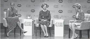  ?? PETE MAROVICH/ GETTY IMAGES/ FILE ?? Former first lady Laura Bush, center, then- first lady Michelle Obama, left, and journalist Cokie Roberts in Washington in 2014.