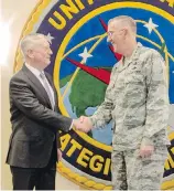  ?? THE ASSOCIATED PRESS ?? Air Force Gen. John E. Hyten, right, shakes hands with U.S. Secretary of Defense Jim Mattis at Offutt Air Force Base in Bellevue, Nebraska, in September.