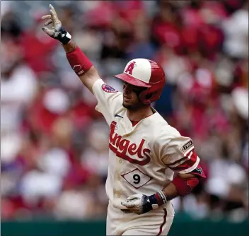  ?? MARK J. TERRILL — THE ASSOCIATED PRESS ?? The Angels’ Zach Neto gestures as he rounds the bases after hitting one of his two home runs in Sunday’s victory.