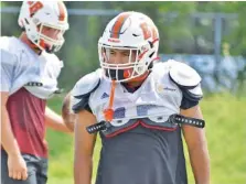  ?? STAFF PHOTO BY PATRICK MACCOON ?? East Ridge senior linebacker and offensive lineman Chris Diaz has lost nearly 60 pounds since last season, with more attention to his diet and extra workouts helping him get in better shape.