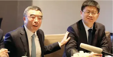  ?? Reuters ?? ↑
Liang Hua and Li Peng at a news conference in Paris.