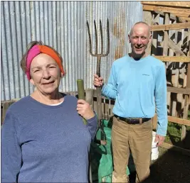  ?? ?? Volunteers Laurie Stanley, left, and Matthew Norby pose for a photo at the community garden at St. Timothy's Episcopali­an Church in Gridley.