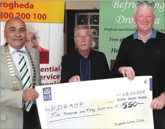  ??  ?? Local Lions Club President, Franklin Fernandes, presents a cheque to Ollie O’Connor and Dave Turner of Drogheda and District Support for Older People. The funds are to be used to set up the organisati­ons new distributi­on centre in Greenhills.