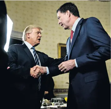  ??  ?? Donald Trump welcomes James Comey, the then director of the FBI, to the Blue Room of the White House in January last year