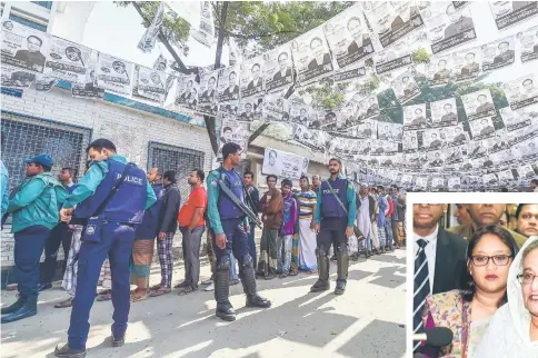  ??  ?? Voters wait in line outside a polling station while security police officials watch over them in Dhaka. — AFP photo