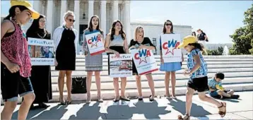  ?? J. SCOTT APPLEWHITE/AP ?? Members of Concerned Women for America show their support Monday for a ruling in favor of a church-run preschool.