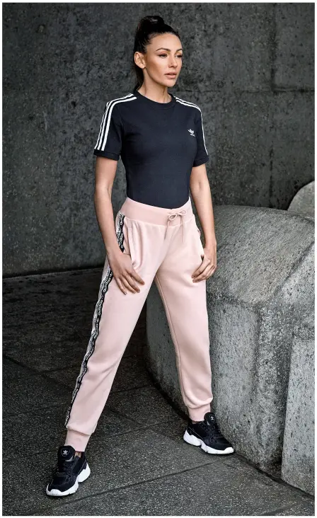  ??  ?? Above: Michelle wears body, £33, tracksuit bottoms, £45, and trainers, £85, all by Adidas at Very