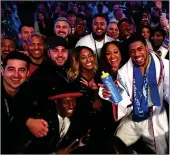  ??  ?? ON TOP OF THE WORLD: Anthony Joshua celebrates with supporters after his victory