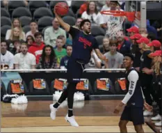  ??  ?? Gonzaga's Silas Melson dunks during a practice session Friday in Glendale, Ariz. AP PHOTO