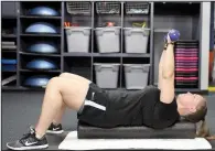  ??  ?? Dawn Saylor does the Iso-Press With Foam Roller, which marries a core-training exercise with muscular tissue rolling.