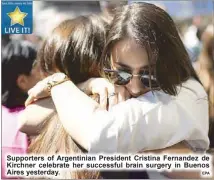  ?? EPA ?? Supporters of Argentinia­n President Cristina Fernandez de Kirchner celebrate her successful brain surgery in Buenos Aires yesterday.