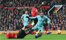  ??  ?? Alexandre Lacazette scores Arsenal’s second goal in a draw at Manchester United that left José Mourinho’s team 18 points off the top of the Premier League. Photograph: Simon Stacpoole/Offside/Getty Images