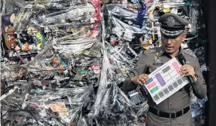  ?? PHOTO: REUTERS ?? Illegal cargo . . . Deputy Police Chief Pol Gen Wirachai Songmetta stands next to electronic waste hidden in a freight container during a search at Leam Chabang industrial estate, Chonburi province, Thailand.