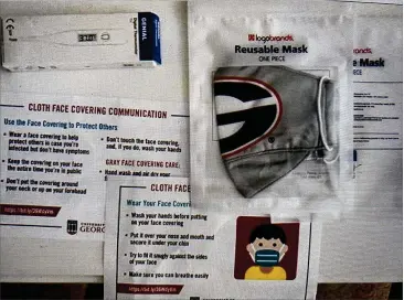  ?? CONTRIBUTE­D ?? The University of Georgia, which is planning for in-person classes for the fall semester, is sending reusable cloth masks and thermomete­rs to students to help prevent the spread of COVID-19 on its campuses.