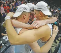  ??  ?? Gonzaga’s Martynas Arlauskas (from left), Drew Timme and Filip Petrusev celebrate March 10, 2020, after defeating Saint Mary’s in an NCAA college basketball game in the final of the West Coast Conference men’s tournament in Las Vegas. (File Photo/AP/John Locher)