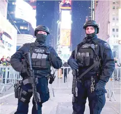  ??  ?? Security officers on patrol during New Year’s Eve at Times Square in New York City. — AFP photo