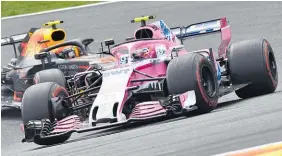  ?? Photo / AP ?? Esteban Ocon ahead of Max Verstappen during the Belgian Grand Prix.