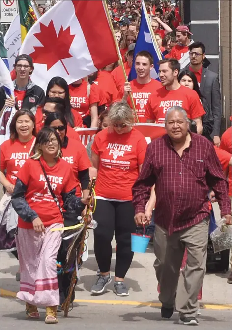  ?? Photo by Matthew Liebenberg­t ?? Walk participan­ts on their way to Market Square in downtown Swift Current, May 14.