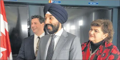  ?? ASHLEY FITZPATRIC­K/THE TELEGRAM ?? St. John’s East MP Nick Whalen (left), Long Range Mountains MP Gudie Hutchings (right) and Minister of Innovation, Science and Economic Developmen­t Navdeep Bains take questions about Budget 2018 following an event at C-CORE at Memorial University of...