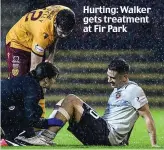  ??  ?? Hurting: Walker gets treatment at Fir Park