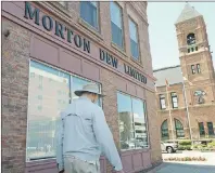  ?? #3*"/ .$*//*4 5)& (6"3%*"/ ?? A pedestrian walks past the Morton Dew Limited offices on Queen Street in Charlottet­own Wednesday. Frank Harrison Dew, 50, appeared before Judge John Douglas in provincial court in Charlottet­own for sentencing after previously pleading guilty to 26...