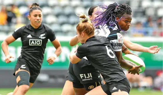  ?? Photo: Oceania Rugby ?? Fijiana 7s forward Raijeli Daveua commits two New Zealand players during the PacificAus­t Sports Oceania Sevens competitio­n at the Queensland Country Bank Stadium in Townsville, Australia on June 27, 2021. Daveua is a top contender to retain her spot in the 13-member squad for the Tokyo Olympic Games in Japan.