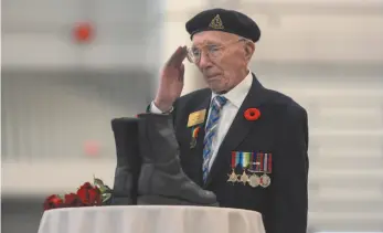  ?? CP PHOTO ?? D-Day veteran Art Eyres is emotional while saluting a memorial for soldiers who fell at the Battle of Normandy during a ceremony commemorat­ing the 75th anniversar­y of D-day in Halifax on Thursday.