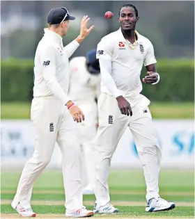  ??  ?? On the ball: Joe Root (left) chats with Jofra Archer, who took two wickets yesterday