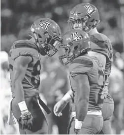  ?? CASEY SAPIO/USA TODAY SPORTS ?? Arizona wide receiver Stanley Berryhill III, left, and running back J.J. Taylor (21) celebrate after a touchdown against Oregon.