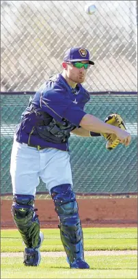  ?? ASSOCIATED PRESS ?? Catcher Jonathan Lucroy has immersed himself in daily activities of this camp and is working hard on his game.
