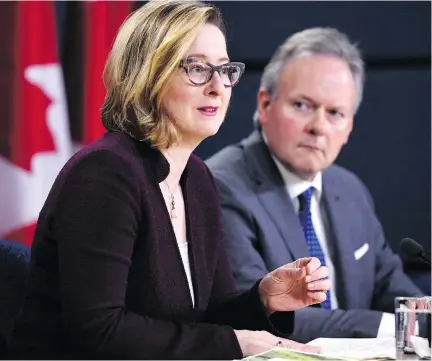  ?? JUSTIN TANG/THE CANADIAN PRESS ?? Bank of Canada governor Stephen Poloz and senior deputy governor Carolyn Wilkins announce the economic outlook in April. Most observers expect the central bank to lift interest rates to 1.5 per cent on July 11, which would be the first increase since January.
