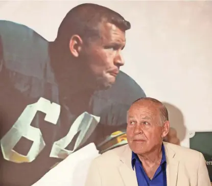  ?? ADAM WESLEY / USA TODAY NETWORK-WISCONSIN ?? Jerry Kramer is introduced at the opening of an exhibit featuring his Packers career at the Green Bay Packers Hall of Fame on July 25. He will go into the Pro Football Hall of Fame on Saturday.