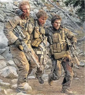  ??  ?? THREE AMIGOS: Matt Axelson (Ben Foster), Danny Dietz (Emile Hirsch) and Marcus Luttrell (Mark Wahlberg) are out to shoot things