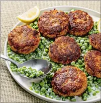  ?? LAURA CHASE DE FORMIGNY /THE WASHINGTON POST ?? Ricotta and Potato Chip Fish Cakes With Peas