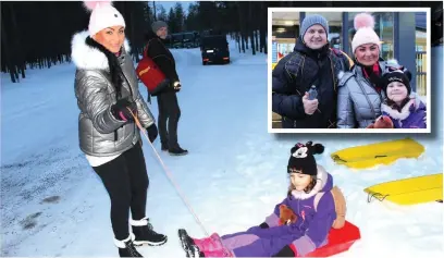  ??  ?? ●Eight-year-old Natalia Trendewicz takes a ride on a sledge and (inset) with her mum Joanna and dad Krzysztof