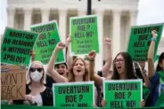  ?? AP PHOTO/GEMUNU AMARASINGH­E ?? Abortion-rights protesters regroup June 24 following Supreme Court’s decision to overturn Roe v. Wade in Washington.