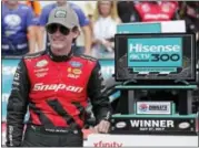  ?? CHUCK BURTON — THE ASSOCIATED PRESS ?? Ryan Blaney poses with the trophy in Victory Lane after winning the NASCAR Xfinity series auto race at Charlotte Motor Speedway in Concord, N.C., Saturday.