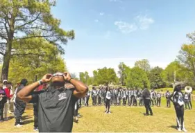  ?? LAURA TESTINO/CHALKBEAT ?? Principal Derek King joins the students viewing the April 8 solar eclipse at Craigmont High School.