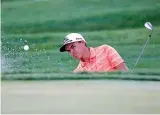  ?? Associated Press ?? Rickie Fowler hits out of a bunker Sunday on the 18th hole at the Honda Classic golf tournament in Palm Beach Gardens, Fla.