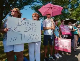  ?? BRETT COOMER/HOUSTON CHRONICLE VIA AP/FILE ?? Anti-abortion demonstrat­ors outside Planned Parenthood in Houston last June after the US Supreme Court ruling.