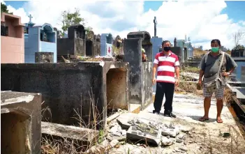  ?? ?? Teo (left) inspects one of the desecrated tombs.