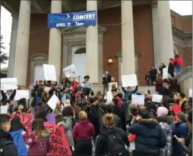  ?? LINDSEY SABADO—THE ASSOCIATED PRESS ?? Syracuse University students gather outside Hendricks Chapel on Wednesday, April 18, 2018 to protest a video made by members of a now-expelled fraternity showing racist and sexist behavior in Syracuse, N.Y.