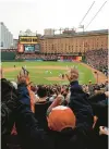  ?? ROB CARR/GETTY ?? Fans celebrate after an Orioles’ victory over the Yankees at Oriole Park at Camden Yards.