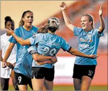  ?? MADDIE MEYER/GETTY-AFP ?? Bianca St. Georges (29) celebrates with the Red Stars’ Rachel Hill, left, Savannah McCaskill (9) and Katie Johnson against Sky Blue FC.